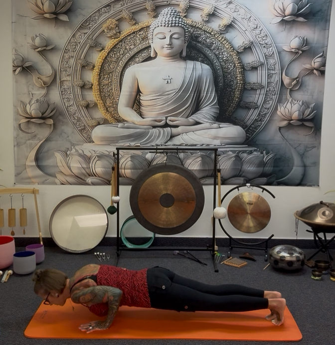 Yoga mats and props arranged in the studio at CJ's Reiki Room